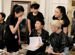 Our official Director of Makeup Artistry, Chika Chan, giving instructions backstage during our 2012 fashion benefit. Photo by: Luan Luu