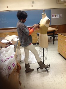 Sade Solomon, designing one of her pieces for "Hope Behind For Horizons." 